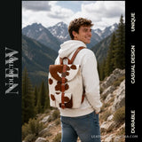 Brown and white hair-on cowhide drawstring backpack – worn as a backpack outdoors