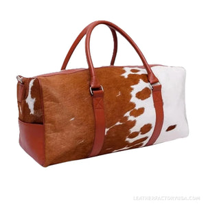 Brown and white hair-on cowhide duffle bag – dimensions 20 x 12 x 10 inches