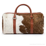 Brown and white hair-on cowhide duffle bag – front view