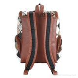 Hair-on cowhide diamond patchwork backpack – back view with brown leather panel and straps