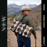 Diamond patchwork hair-on cowhide duffle bag – carried over the shoulder