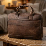 Distressed brown leather laptop messenger bag – front view with zip front pocket