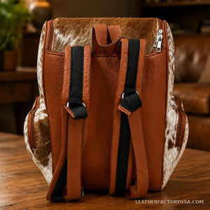 Brown and white hair-on cowhide backpack – dimensions 16 x 10 x 7 inches