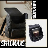 Jet black hand-woven leather backpack – open top flap and interior